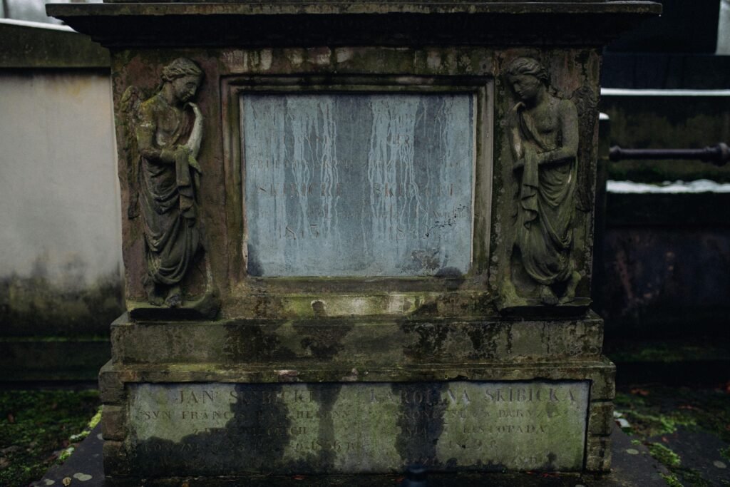 How to safely remove moss and lichen from headstones. A large moss covered grave marker.