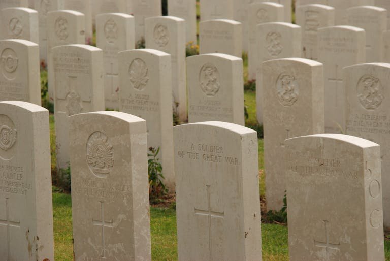 Peaceful view of World War I gravestones in a military cemetery, symbolizing remembrance. Can you visit any cemetery.